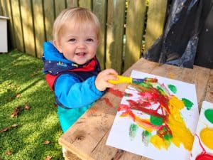 Painting with bright colours outside