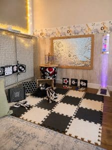 The sensory corner, with black and white mats and the bubble tube