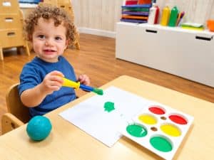 Painting with sponges and pots of colour
